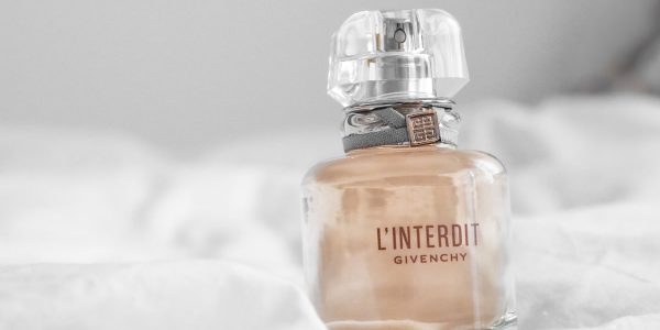 orange and silver perfume bottle