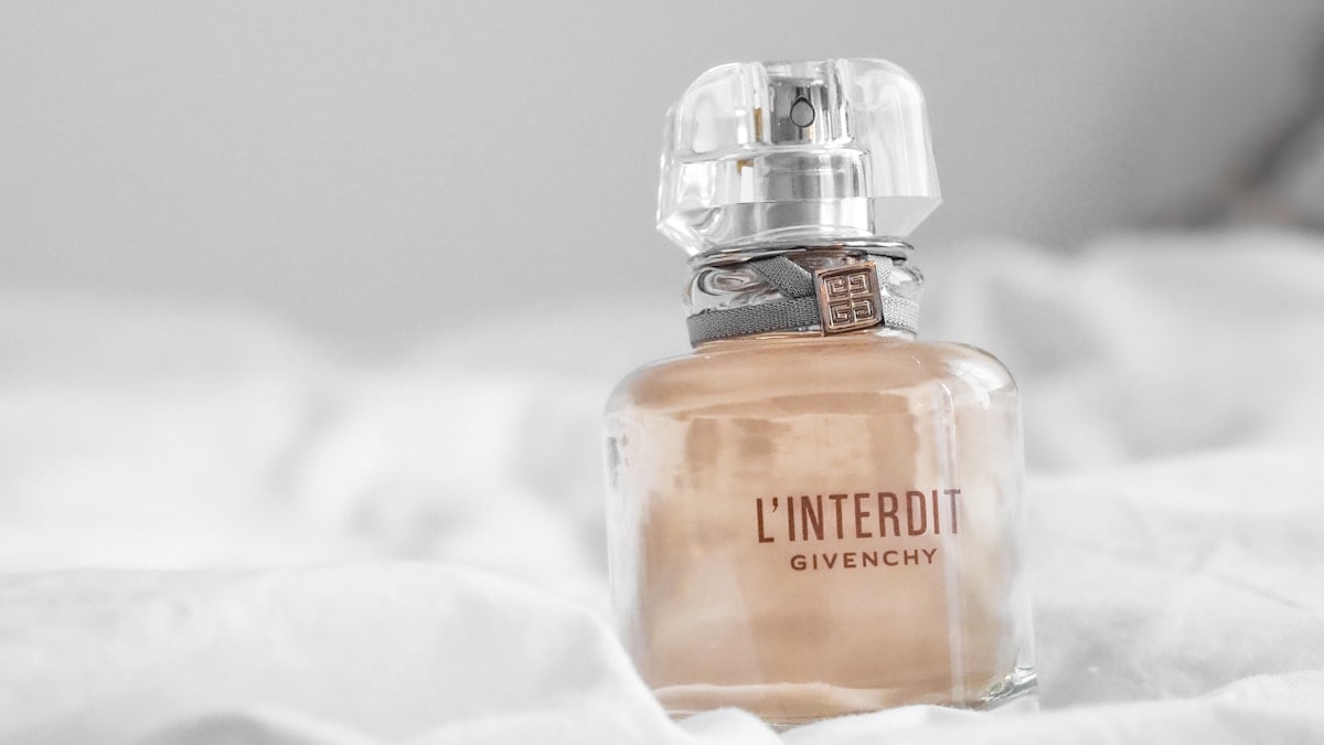 orange and silver perfume bottle
